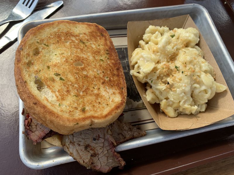 Macaroni and cheese is one of the sides available with entrees, including this beef brisket sandwich, which hails from Texas. 